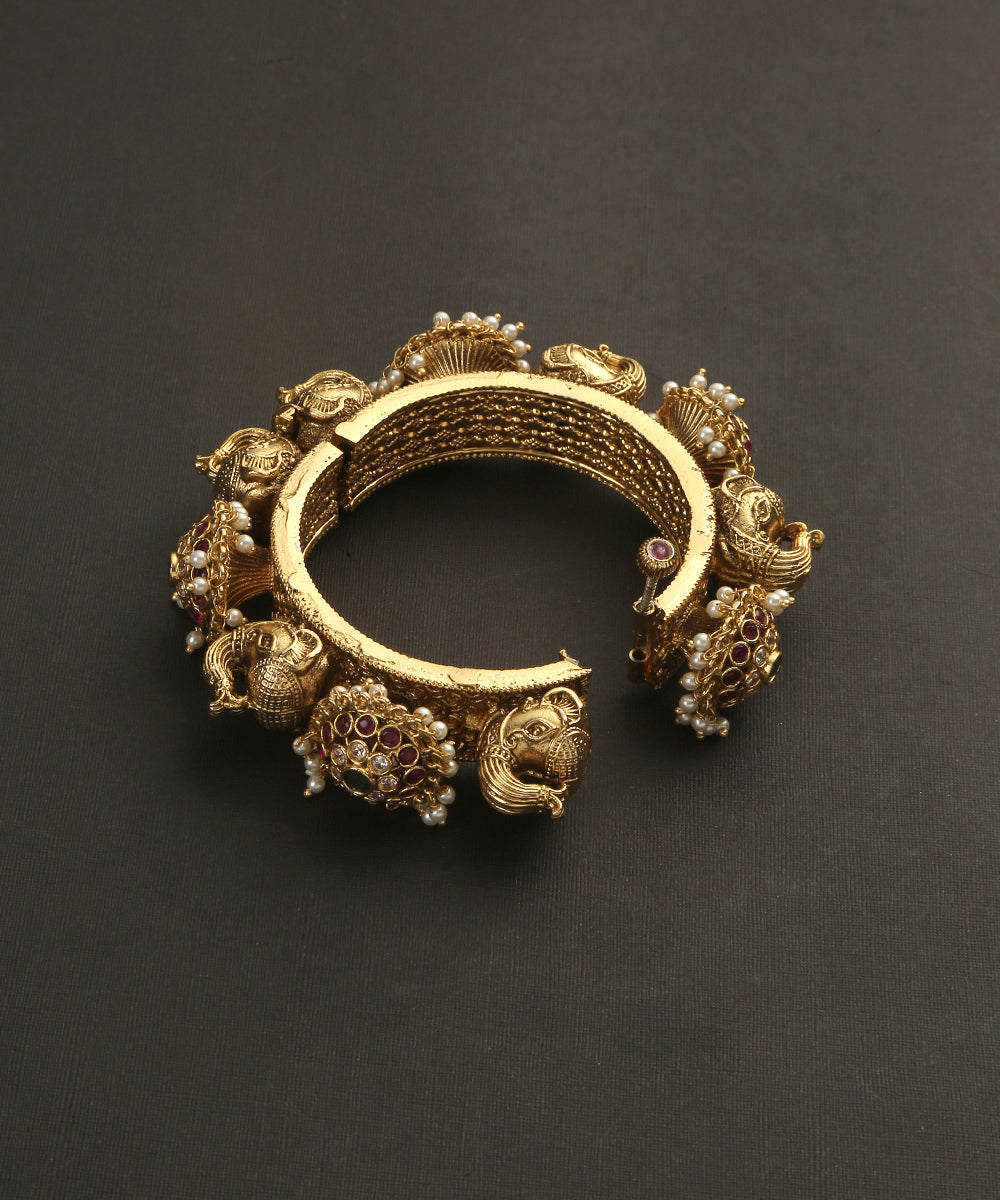 Jana_Handcrafted_Golden_Bangles_With_Peacock_And_Floral_Motifs_WeaverStory_03
