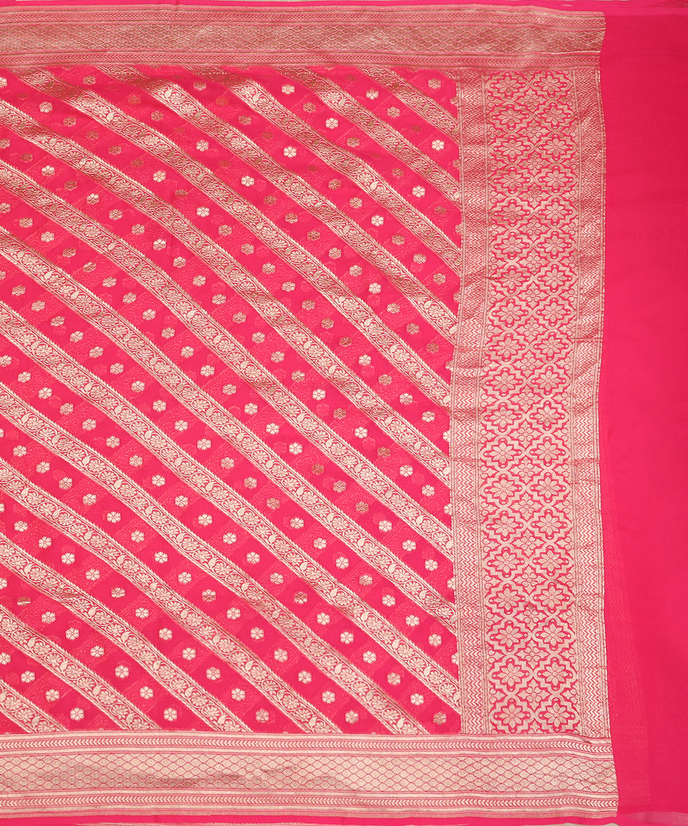 Full view of coral pink handloom Banarasi georgette dupatta with diagonal floral zari bands, scattered bootis and a broad woven border.