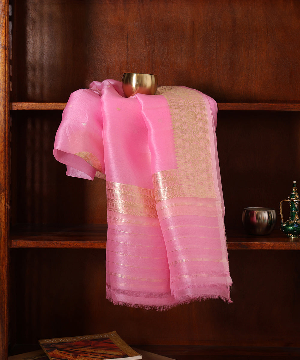 Close-up of pink handloom Kora silk organza dupatta with a circular gold Kadhwa boota, petite zari bootis and woven border.