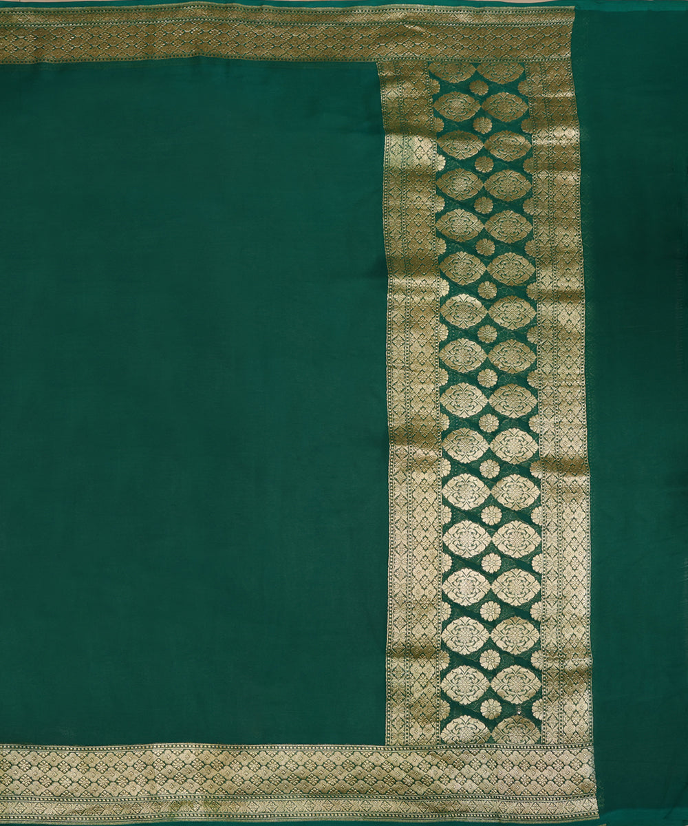 Full view of green handloom Banarasi dupatta with a plain body, gold zari borders and a palla of large floral motifs