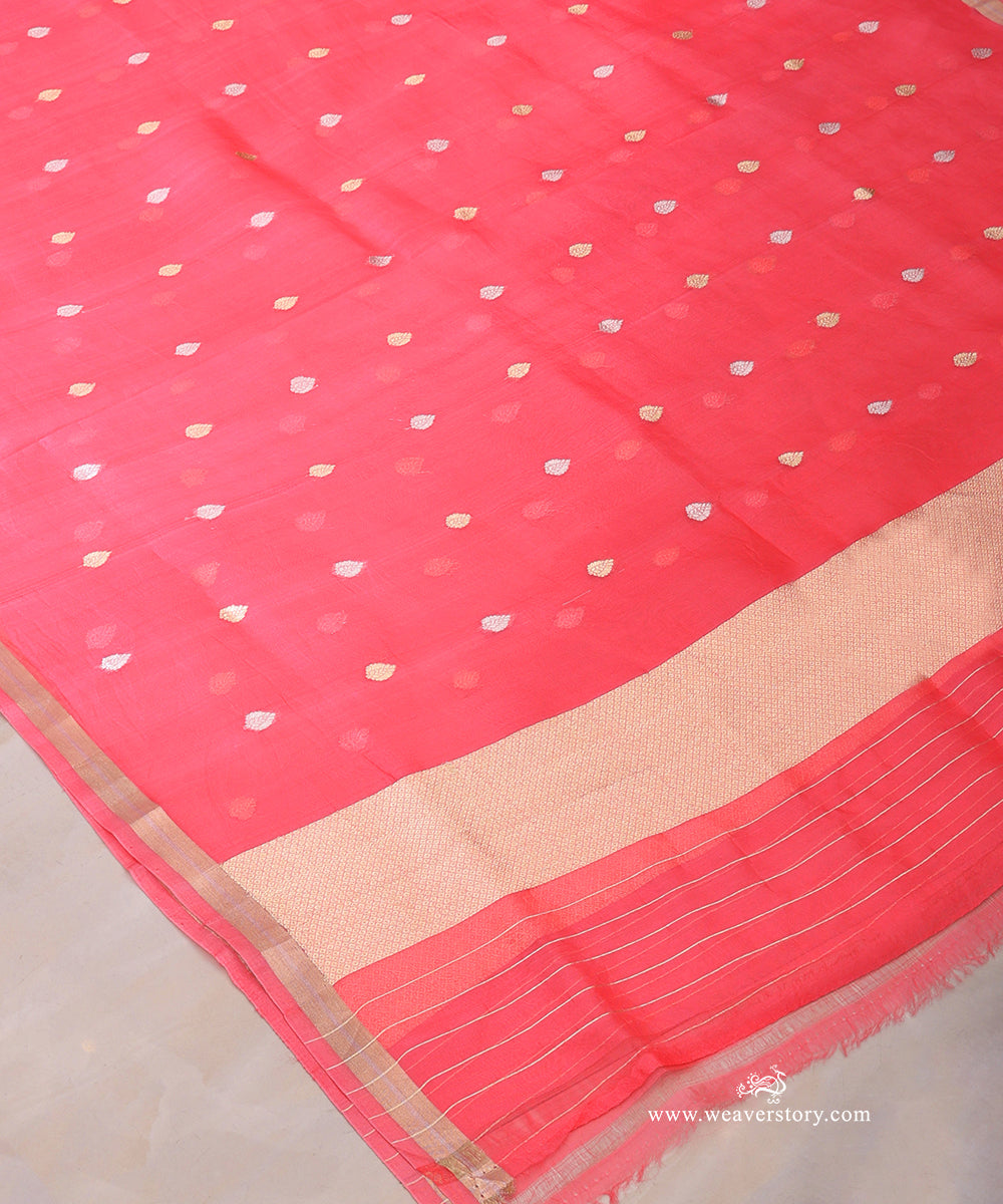 Coral pink Kora silk dupatta with scattered floral bootis, a geometric metallic end panel and fine woven stripes.