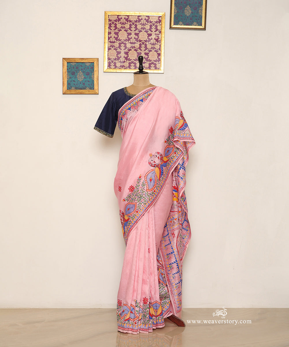 Light pink Chanderi saree with a broad paired bird border and scattered painted flowers.