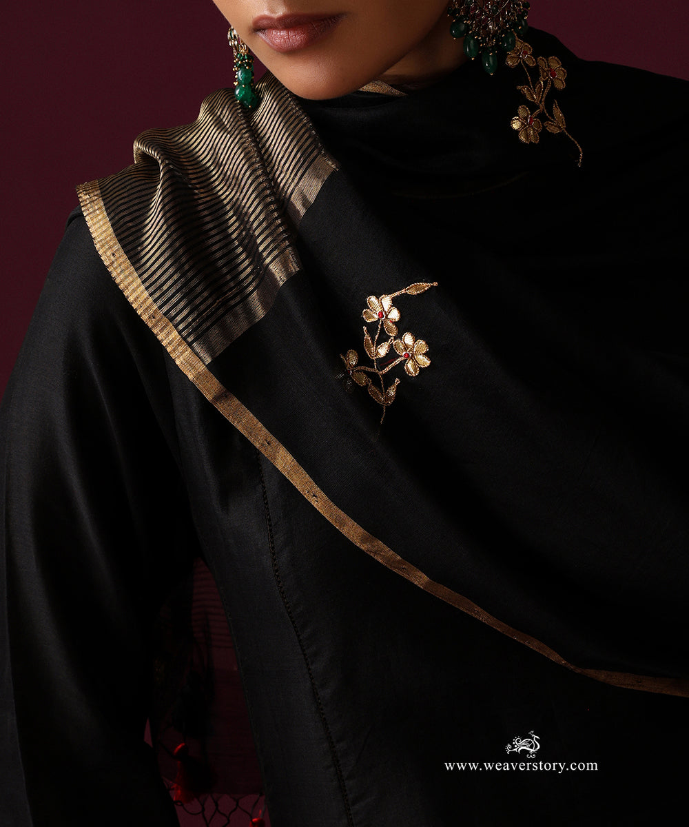 Detail of floral embroidery and the striped gold tissue border on the black Chanderi dupatta