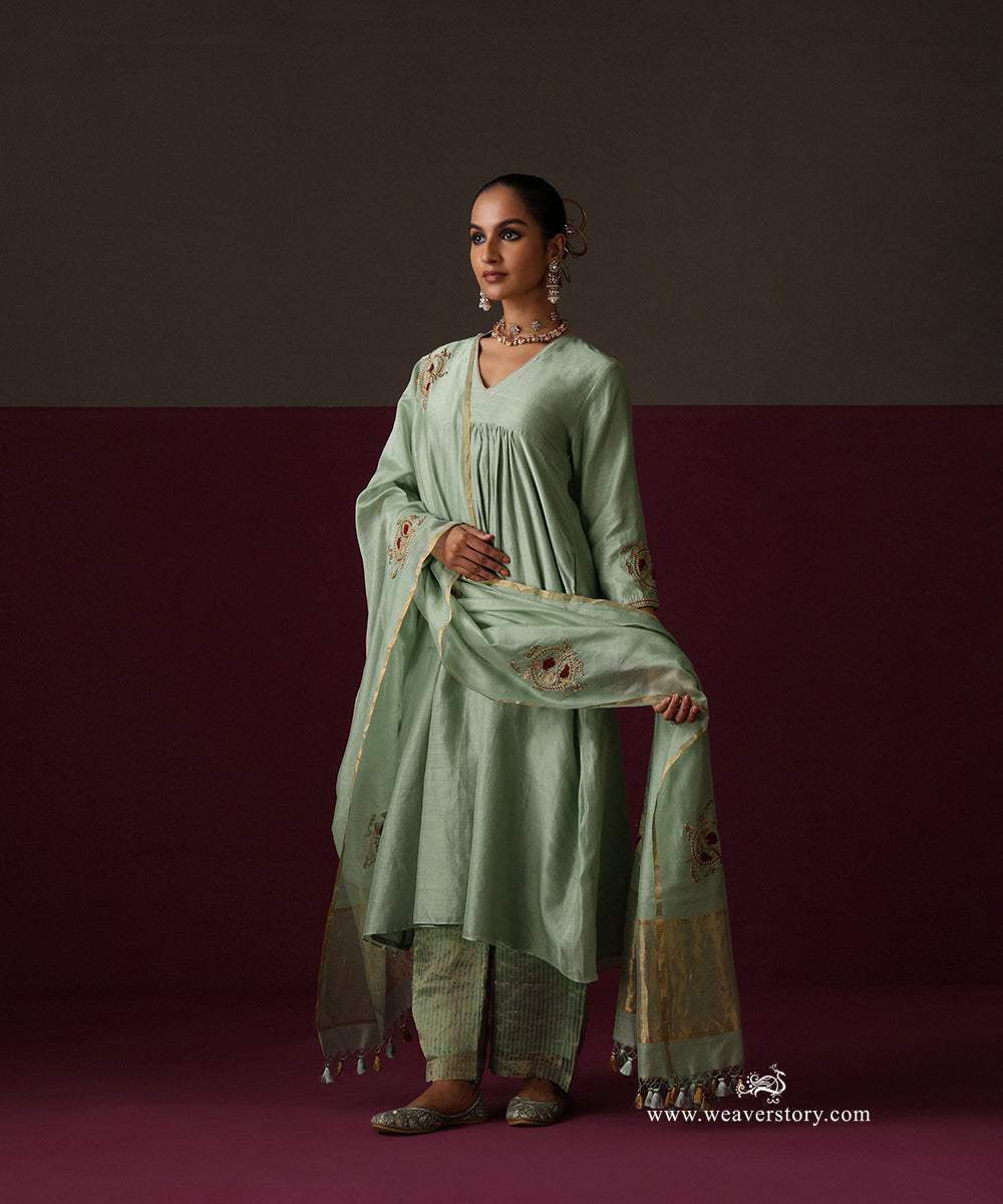 Front view of the sage green V-neck kurta with gathers below the bodice and floral embroidered dupatta