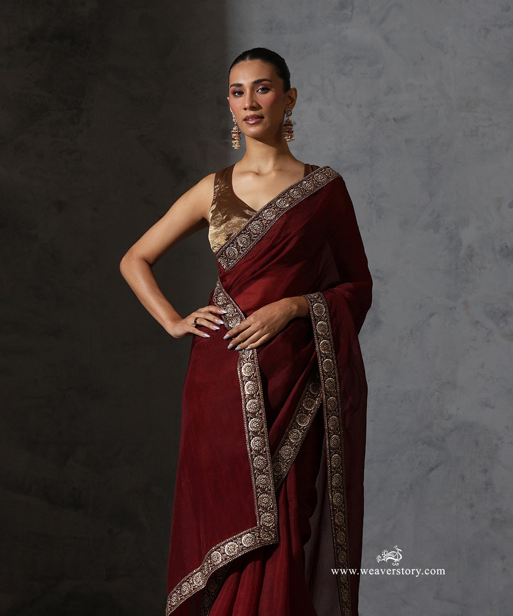 Full draped view of Ragini maroon handwoven pure silk organza saree with zardozi and resham floral border.