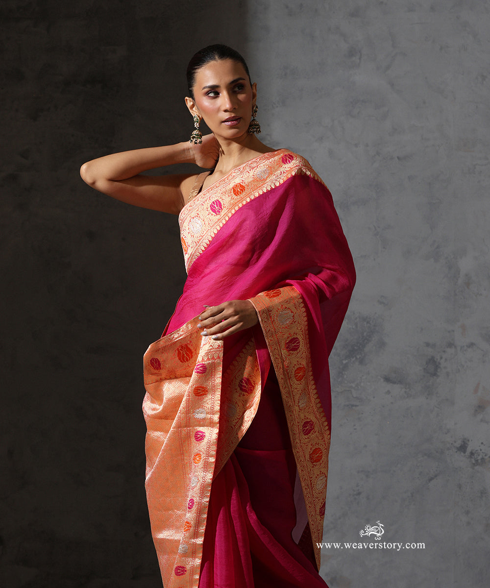 Draped view of Tilottama magenta organza saree highlighting the colourful meenakari motifs and intricate vintage Banarasi zari border.