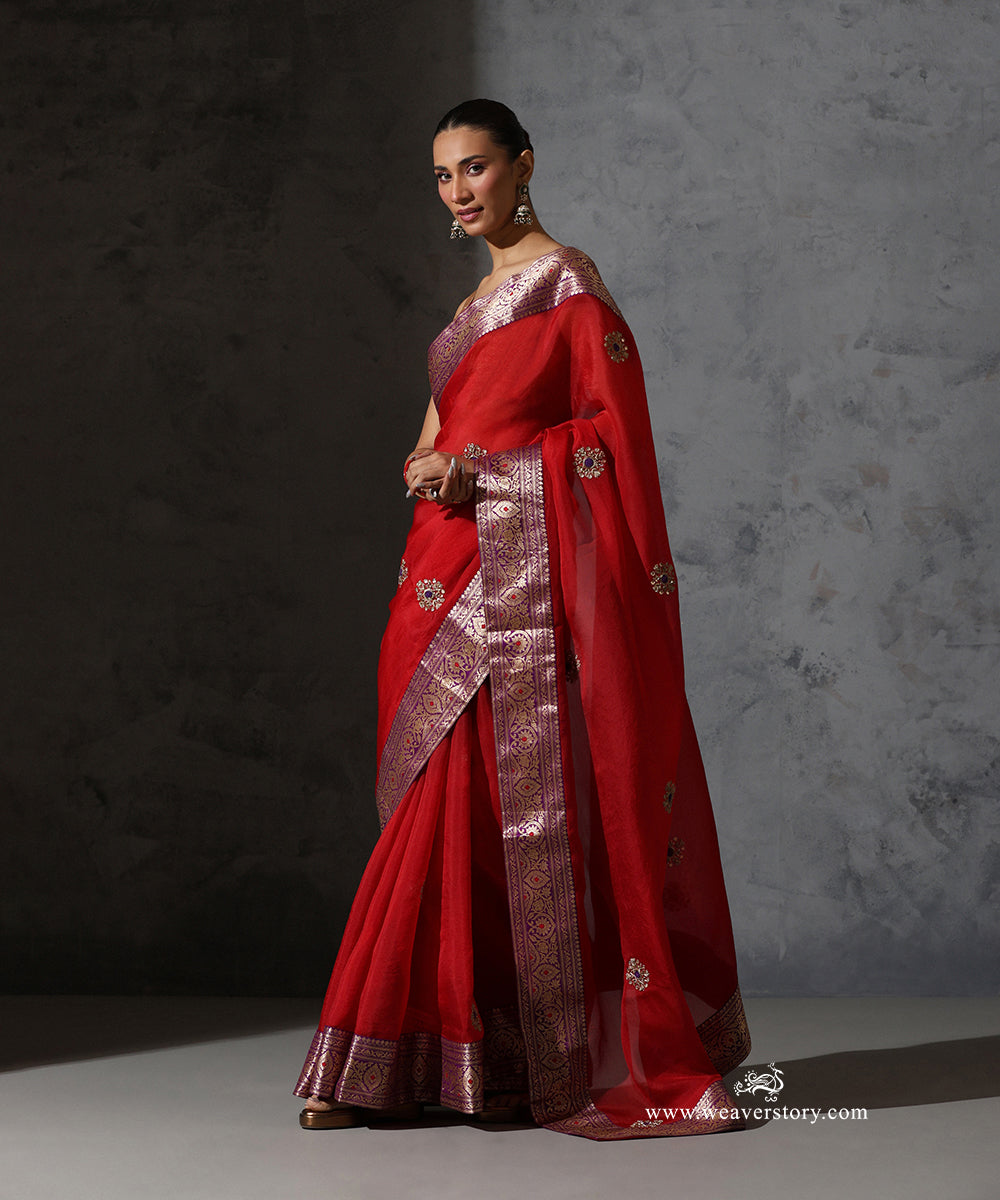 Full front view of Kaushiki red pure silk organza saree with scattered zardozi meenakari bootis and vintage purple Banarasi border.