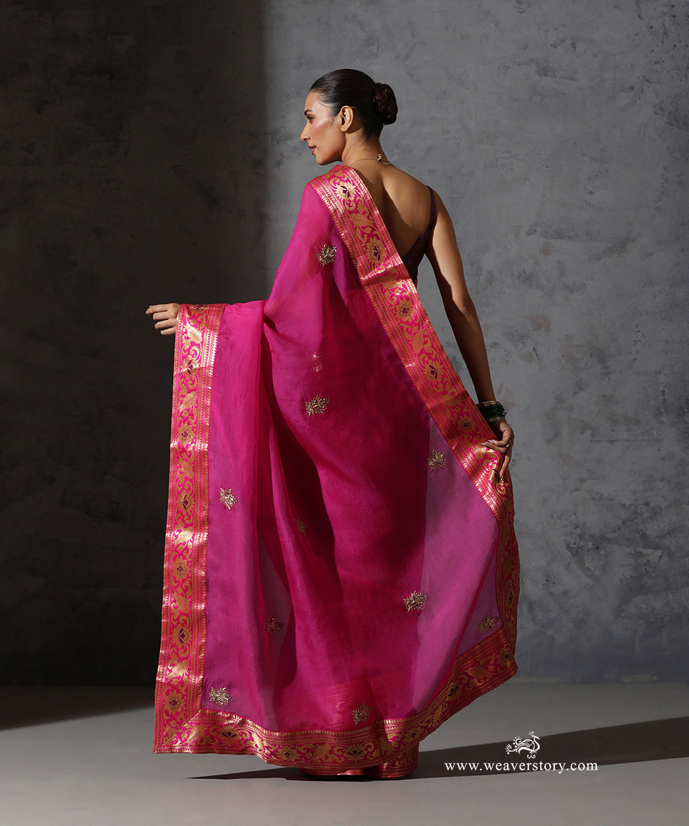 Back view of Madhulika hot pink organza saree showing scattered zardozi meenakari bootis and handwoven Banarasi border.