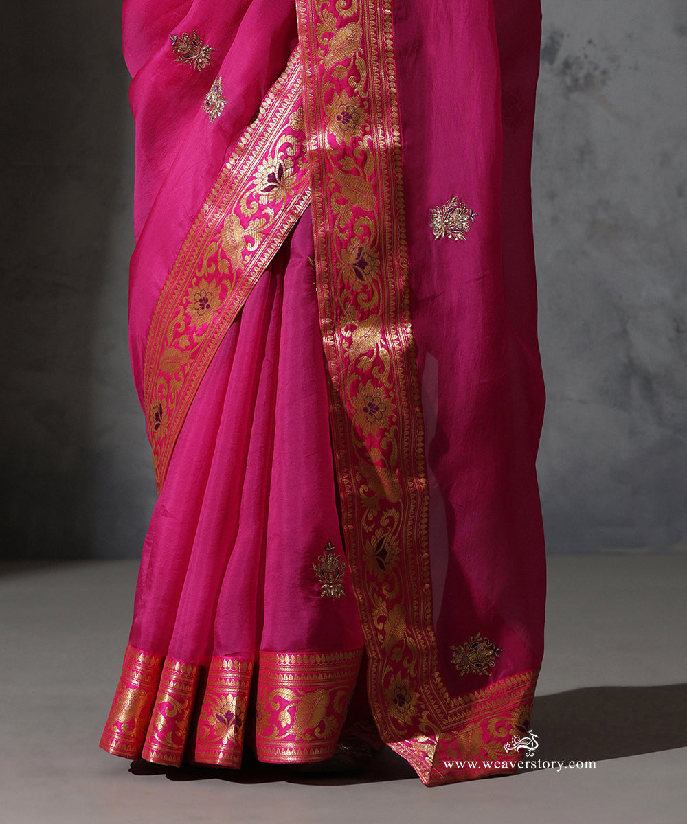 Close-up of Madhulika hot pink pure silk organza saree with hand-embroidered zardozi meenakari bootis and Banarasi zari border.