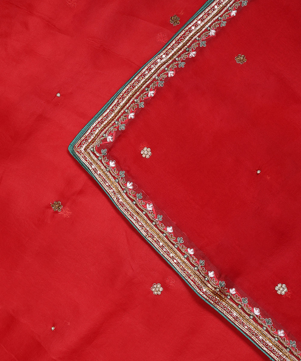 Close-up of red organza dupatta with barik resham and zardozi floral embroidery, scattered bootis and contrasting green finishing