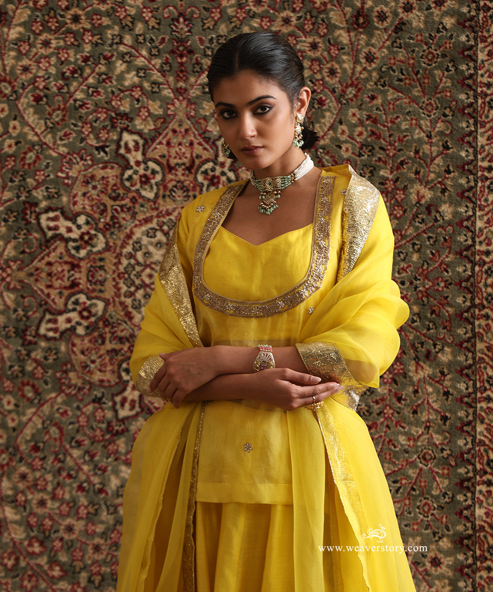 Yellow hand-embroidered organza top with Chanderi silk blouse and Lampi gota dupatta border
