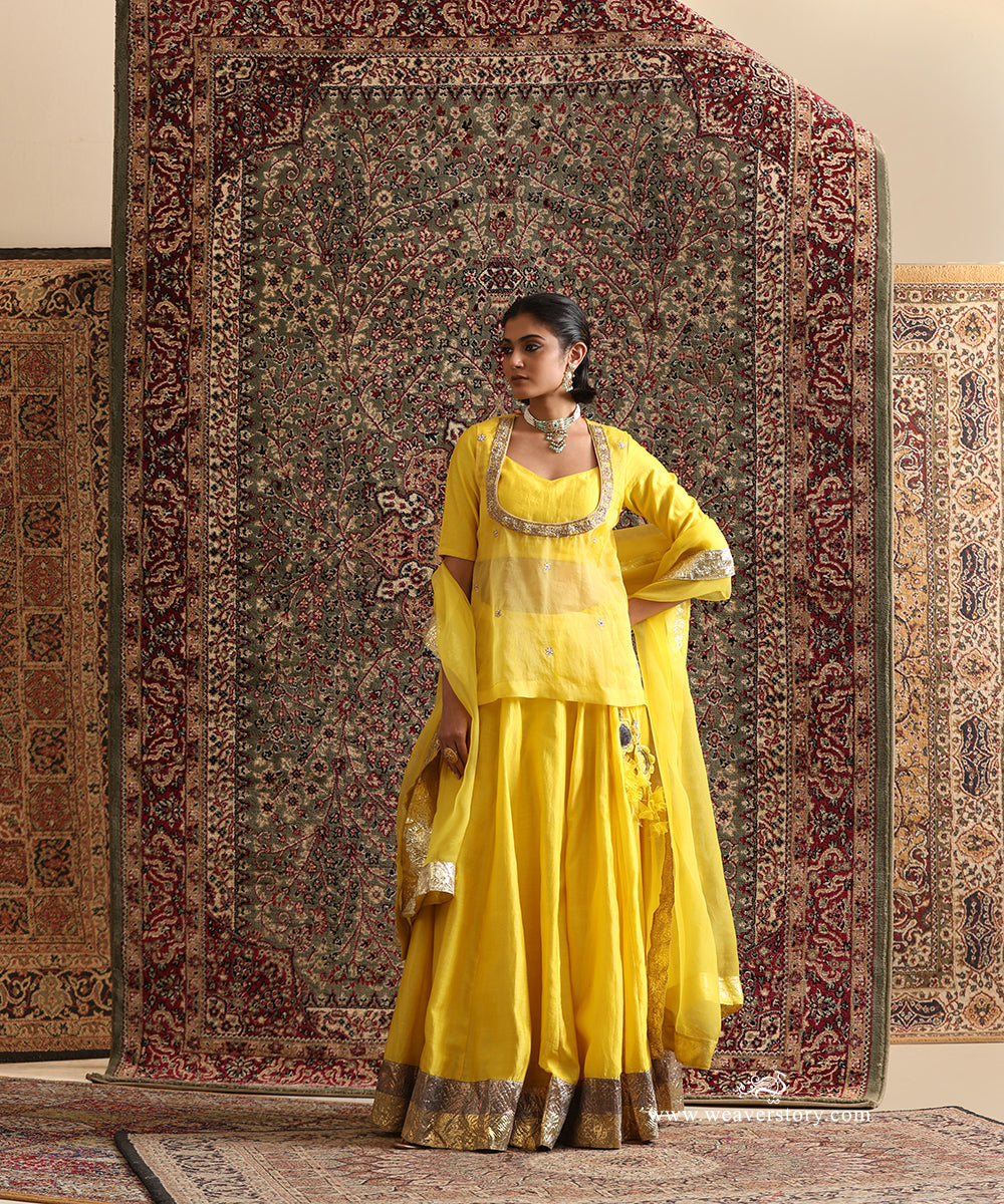 Yellow Chanderi silk lehenga and organza dupatta with two-tone Lampi gota borders