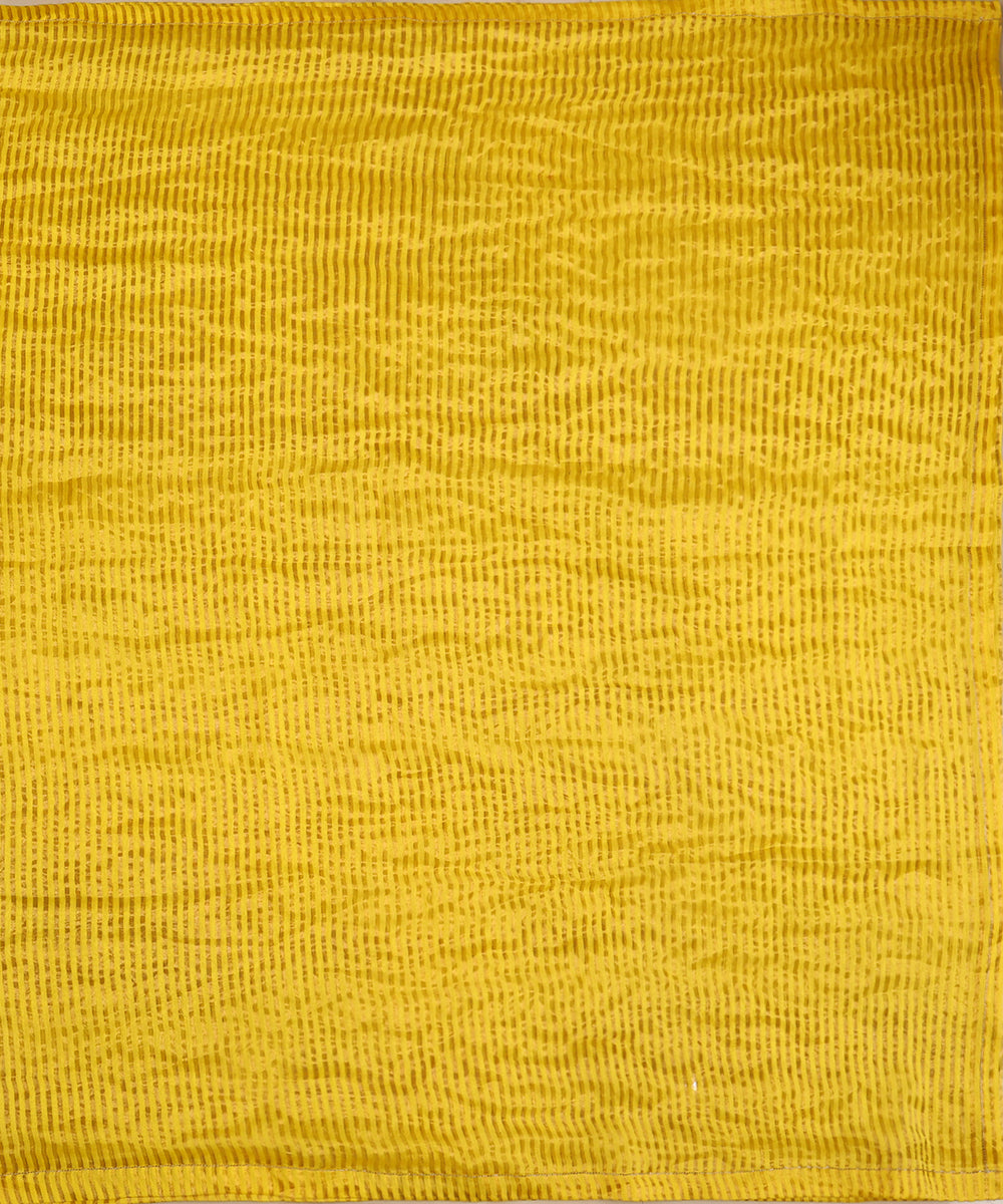 Full view of yellow striped Tissue Chanderi dupatta featuring closely placed linear zari tagai across its luminous surface.
