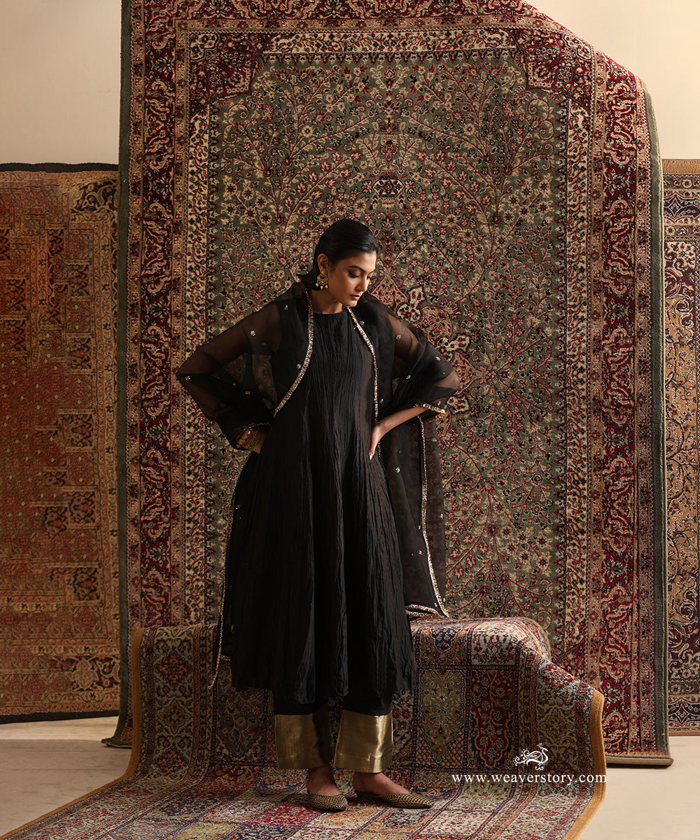 Black pure Chanderi silk wrinkled Anarkali styled with a pure silk organza dupatta featuring hand embroidered floral motifs and a handcrafted kiran border