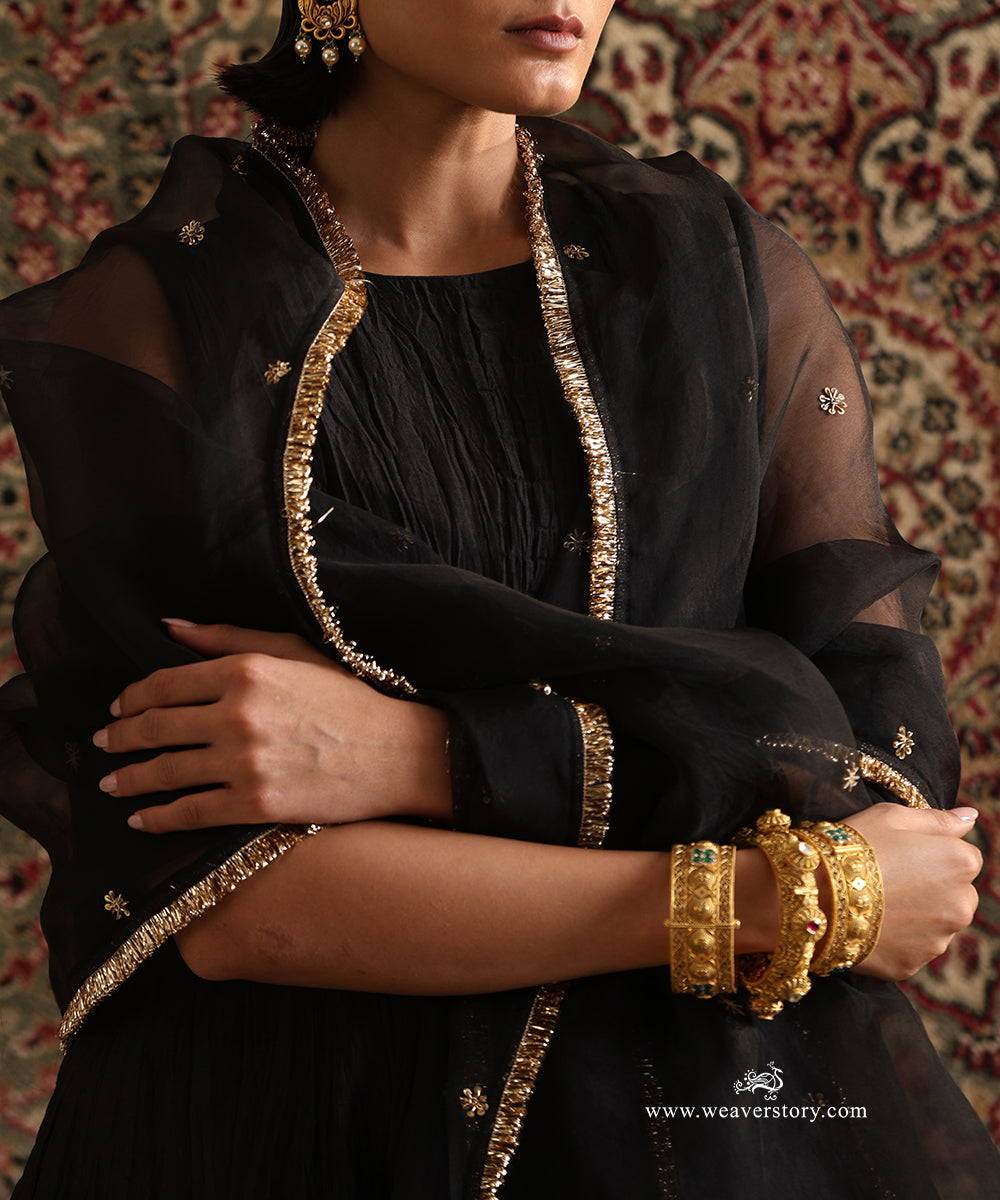 Close-up of black pure silk organza dupatta with hand embroidered floral motifs and handcrafted kiran border paired with a pure Chanderi silk wrinkled Anarkali