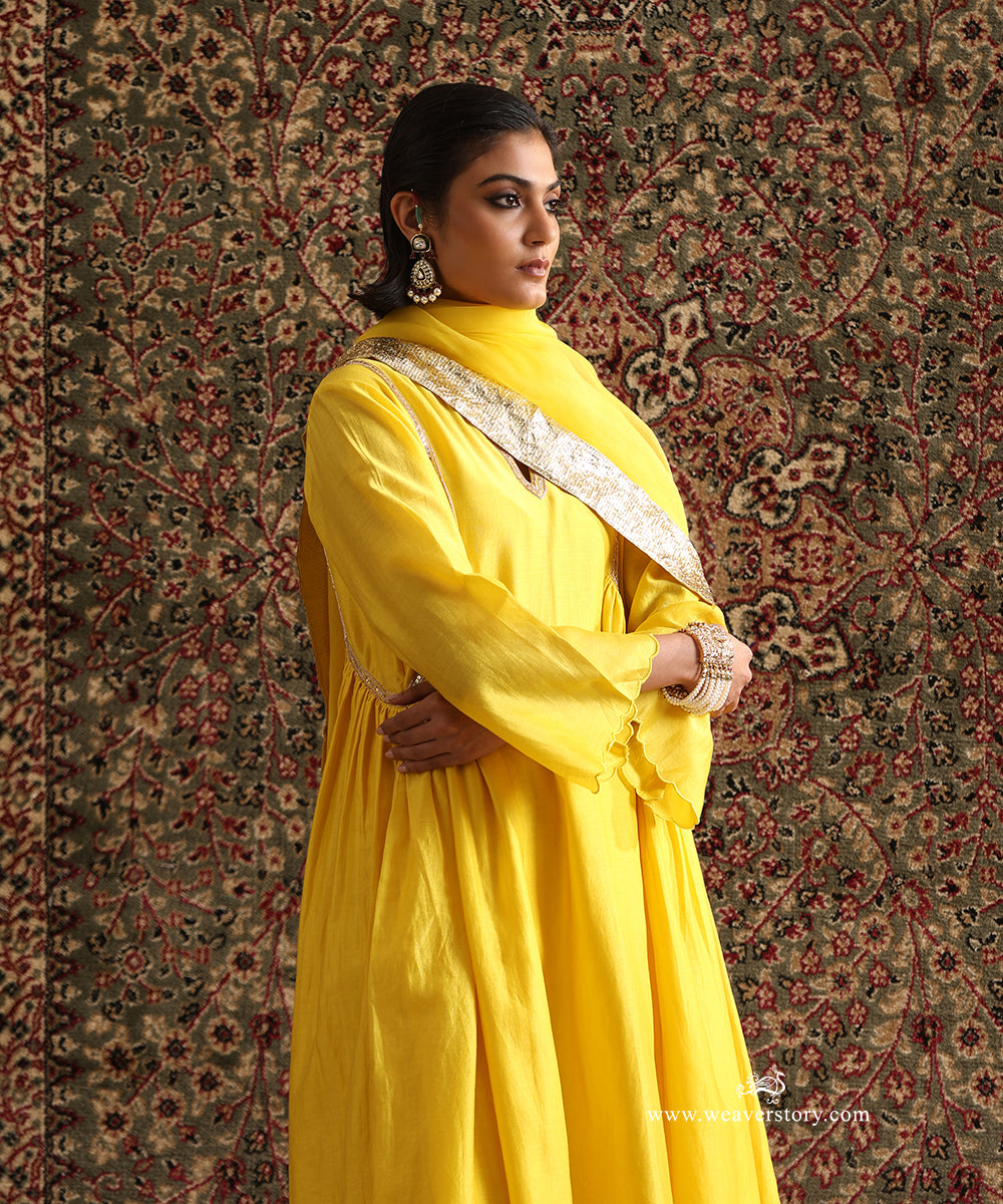 Yellow pure Chanderi silk kurta with hand embroidered neckline and curved panel detailing