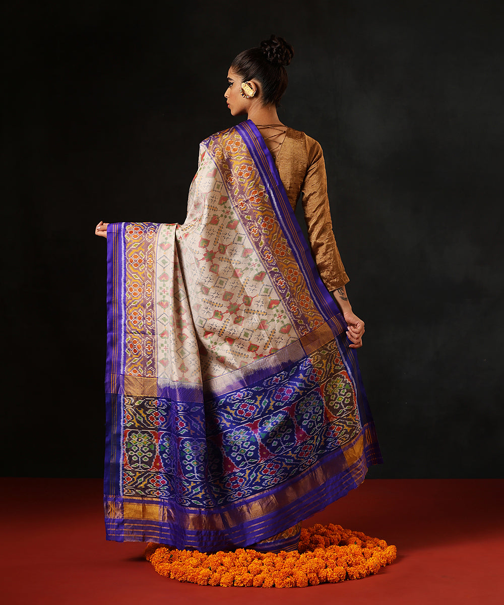 Off White Double Shade Handloom Pure Mulberry Silk Single Ikat Patola Saree With Blue Tissue Border