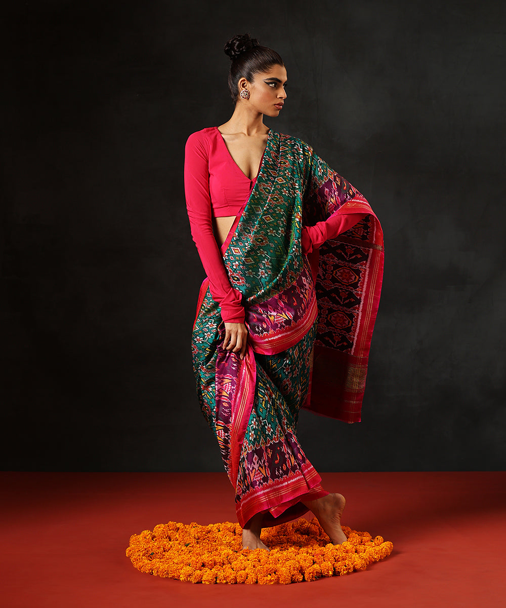 Handloom Teal Blue And Green Double Warp Pure Mulberry Silk Ikat Patola Saree With Pink Border
