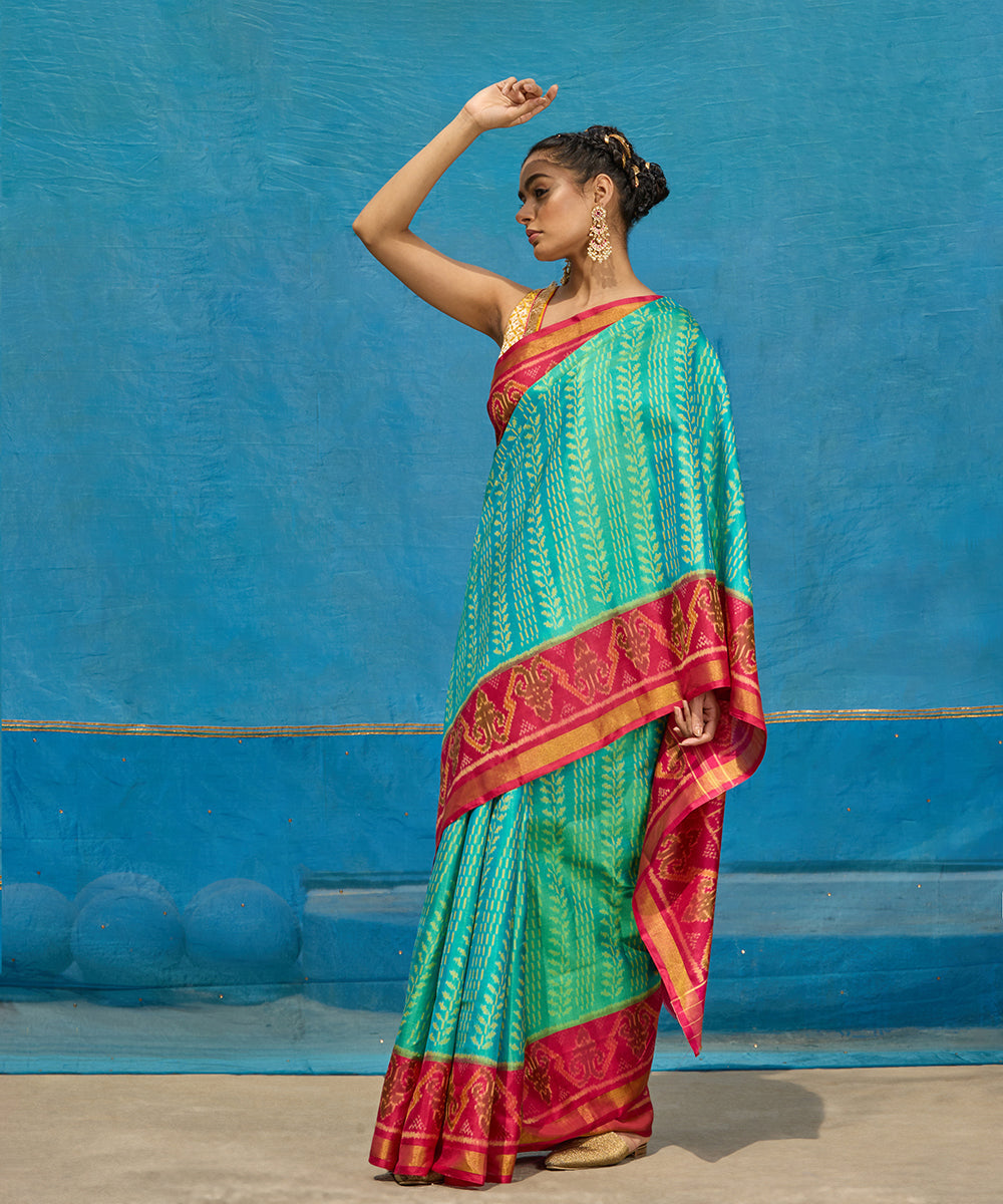 Handloom_Aqua_Blue_Pure_Mulberry_Silk_Ikat_Patola_Saree_With_Pink_Border_And_Palla_WeaverStory_01