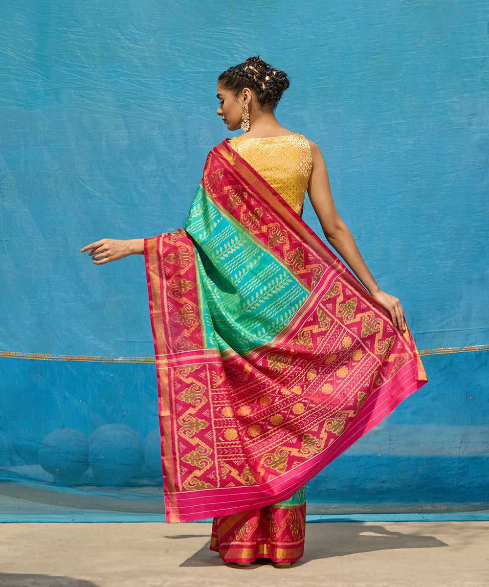 Handloom_Aqua_Blue_Pure_Mulberry_Silk_Ikat_Patola_Saree_With_Pink_Border_And_Palla_WeaverStory_03