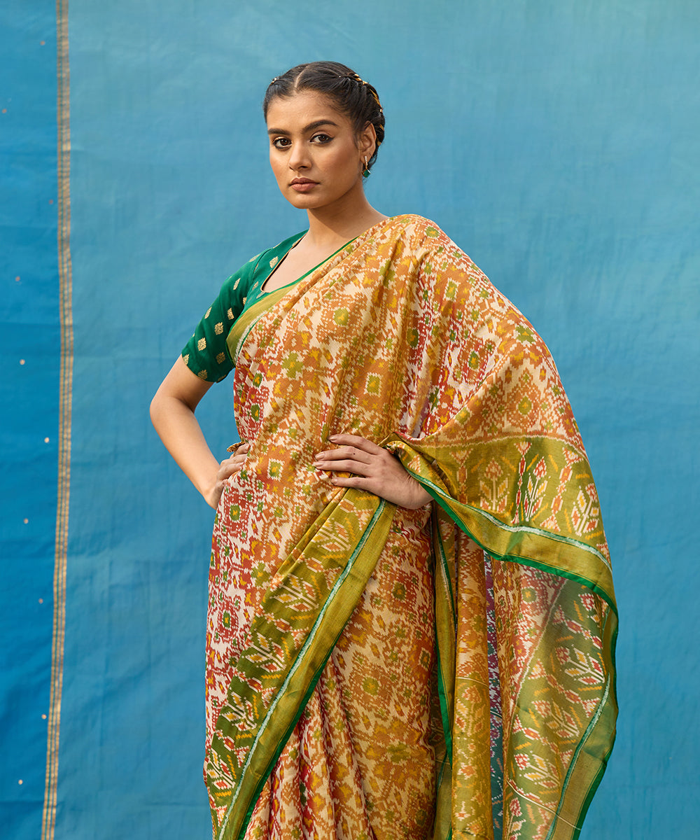 Handloom_Rust_And_Green_Pure_Tissue_Mulberry_Silk_Ikat_Patola_Saree_WeaverStory_02