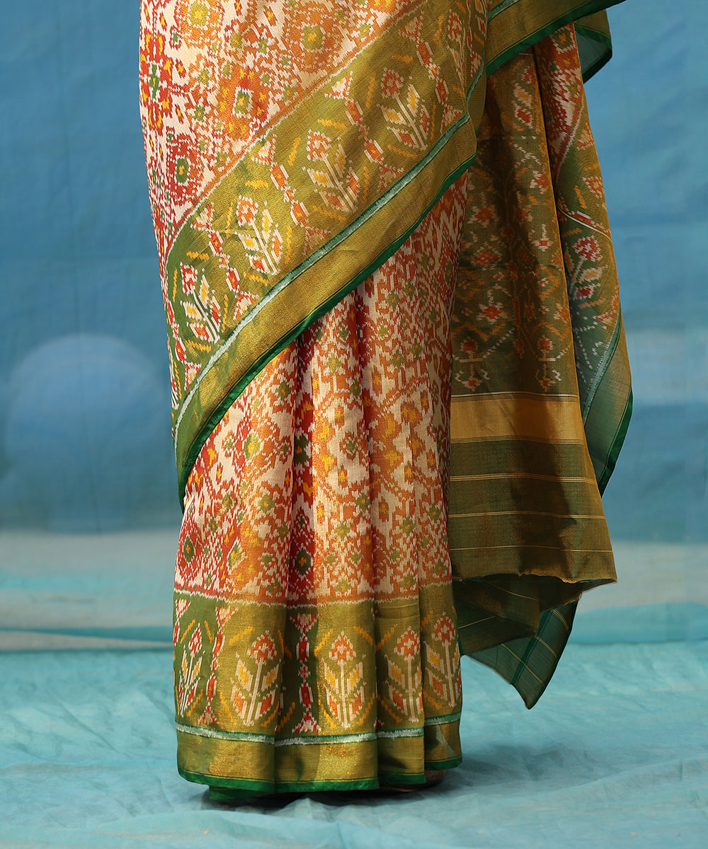 Handloom_Rust_And_Green_Pure_Tissue_Mulberry_Silk_Ikat_Patola_Saree_WeaverStory_03