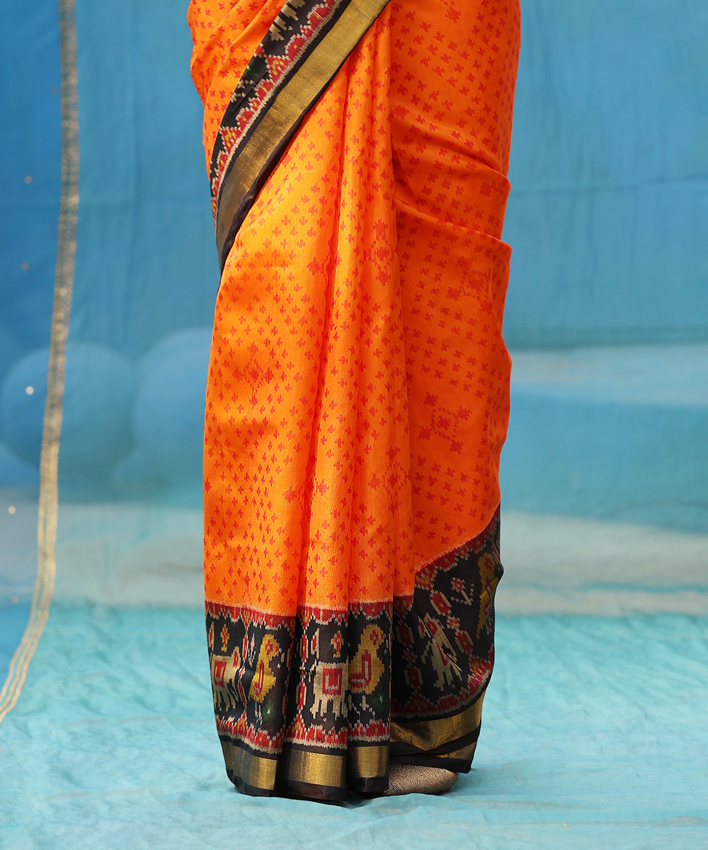 Orange_And_Black_Handloom_Pure_Mulberry_Silk_Ikat_Patola_Saree_With_Black_Border_And_Palla_WeaverStory_03