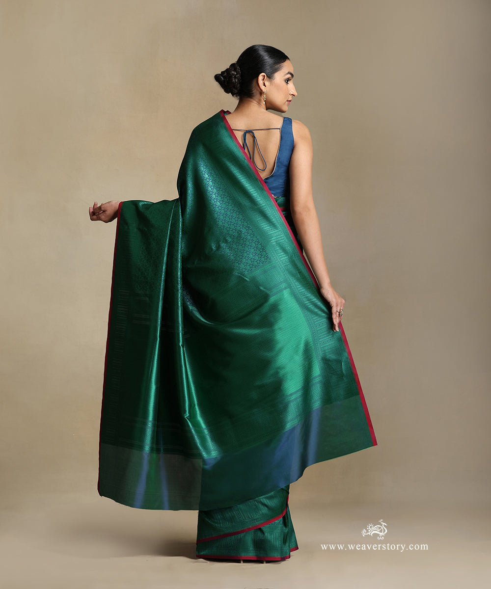 Teal_Handloom_Pure_Katan_Silk_Tanchoi_Banarasi_Saree_With_Green_Jaal_And_Pink_Selvedge_WeaverStory_03