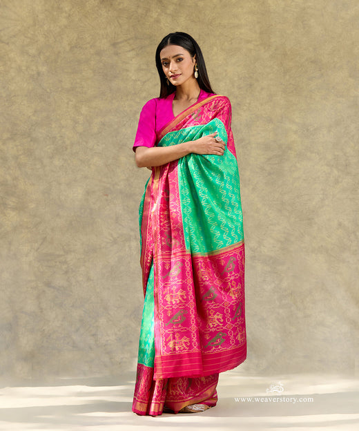 Aqua Blue And Green Handloom Pure Pure Mulberry Silk Ikat Patola Saree With Pink Border Pallu