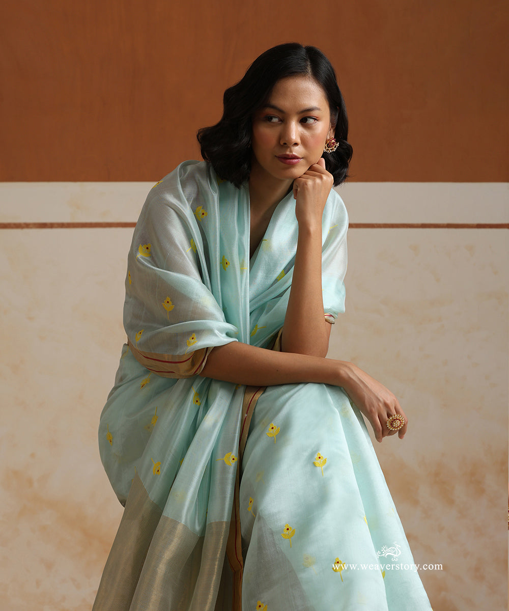 Handloom_Ice_Blue_Pure_Silk_Chanderi_Saree_With_Yellow_Meena_Flower_Motifs_And_Gold_Zari_Border_With_Maroon_Lines_WeaverStory_01