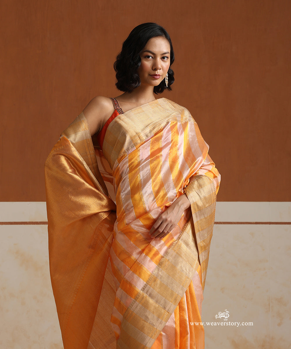 Handloom_Peach_And_Yellow_Striped_Pure_Silk_Chanderi_Saree_With_Heavy_Saffron_Border_WeaverStory_02