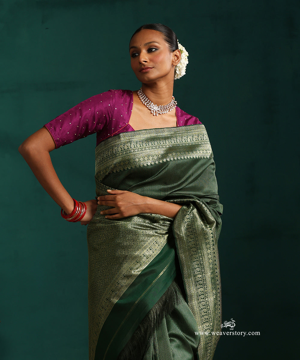 Bottle_Green_Pure_Silk_Kanjivaram_Saree_With_Antique_Silver_Zari_Stripes_And_Paisley_And_Annapakshi_Border_WeaverStory_02