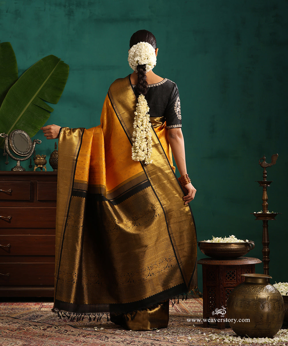 Turmeric Yellow Pure Silk Pure Zari Kanjivaram Saree With Rudraksh And Annapakshi Motifs And Black Korwai Border