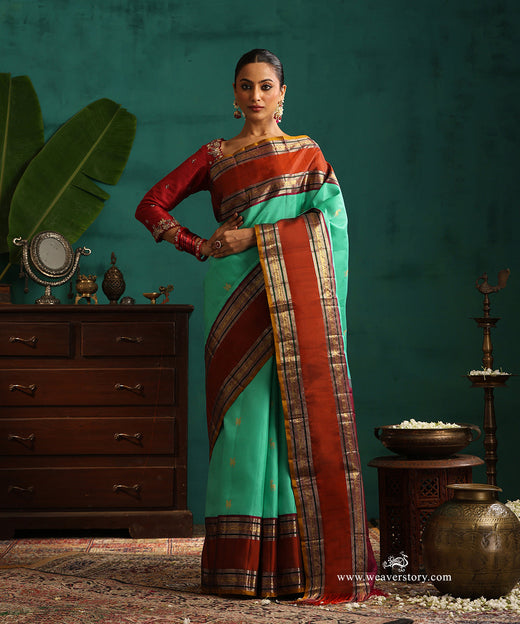 Aqua Green Handloom Pure Silk Kanjivaram Silk Saree With Deer Motifs And Rust Korwai Border