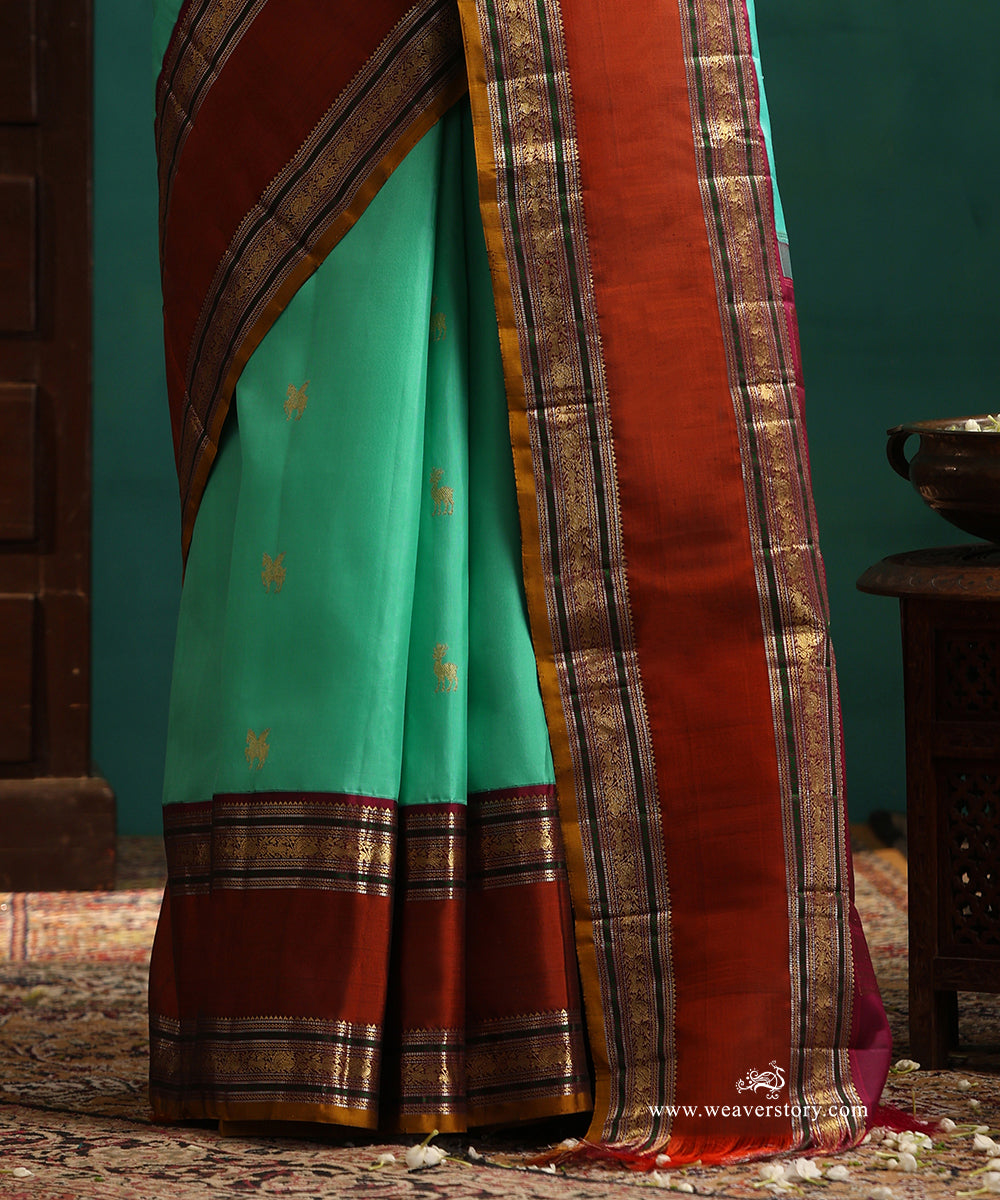 Aqua_Green_Handloom_Pure_Silk_Kanjivaram_Silk_Saree_With_Deer_Motifs_And_Rust_Korwai_Border_WeaverStory_04