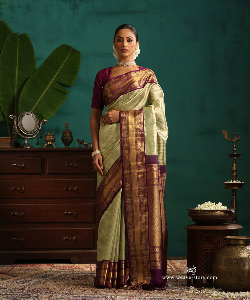 Pastel_Green_And_Gold_Handloom_Pure_Silk_Tissue_Kanjivaram_Saree_With_Purple_Korwai_Annapakshi_Border_WeaverStory_01
