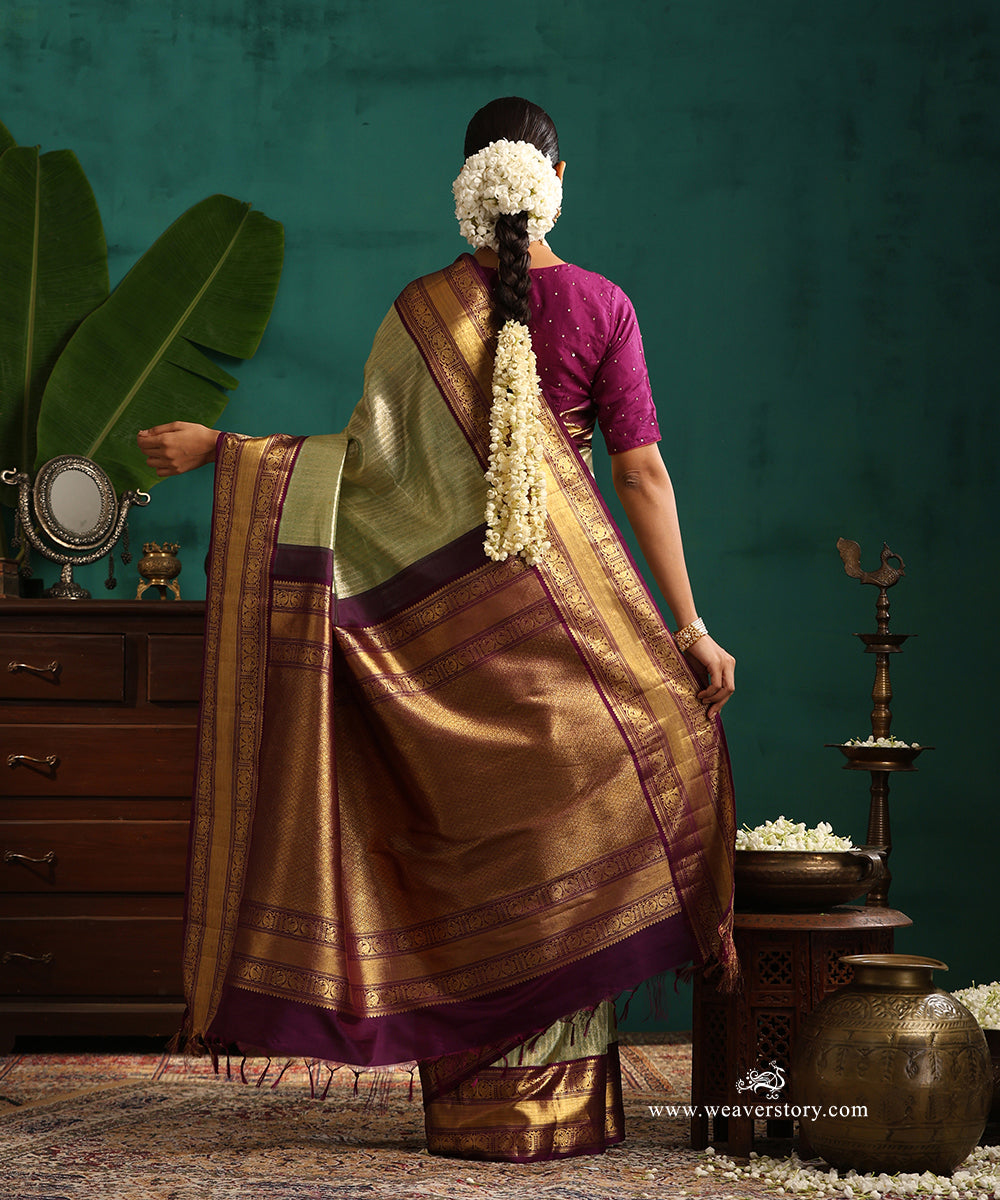 Pastel_Green_And_Gold_Handloom_Pure_Silk_Tissue_Kanjivaram_Saree_With_Purple_Korwai_Annapakshi_Border_WeaverStory_03