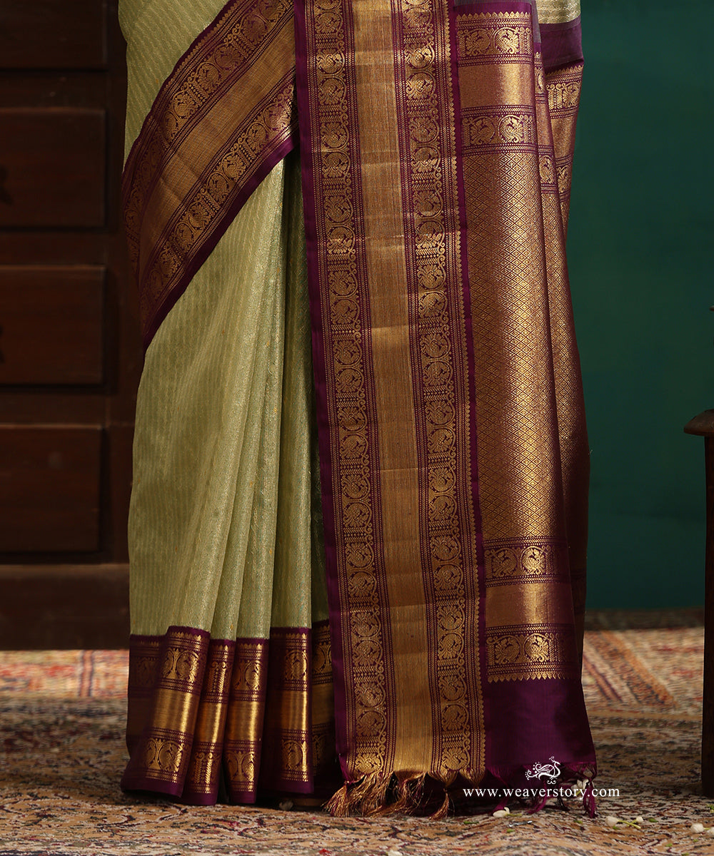 Pastel_Green_And_Gold_Handloom_Pure_Silk_Tissue_Kanjivaram_Saree_With_Purple_Korwai_Annapakshi_Border_WeaverStory_04