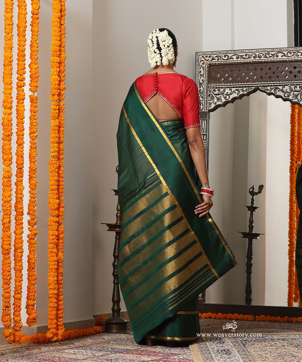 Bottle Green Handloom Pure Silk Kanjivaram Saree With Allover Horizontal Golden Zari Lines And Golden Border