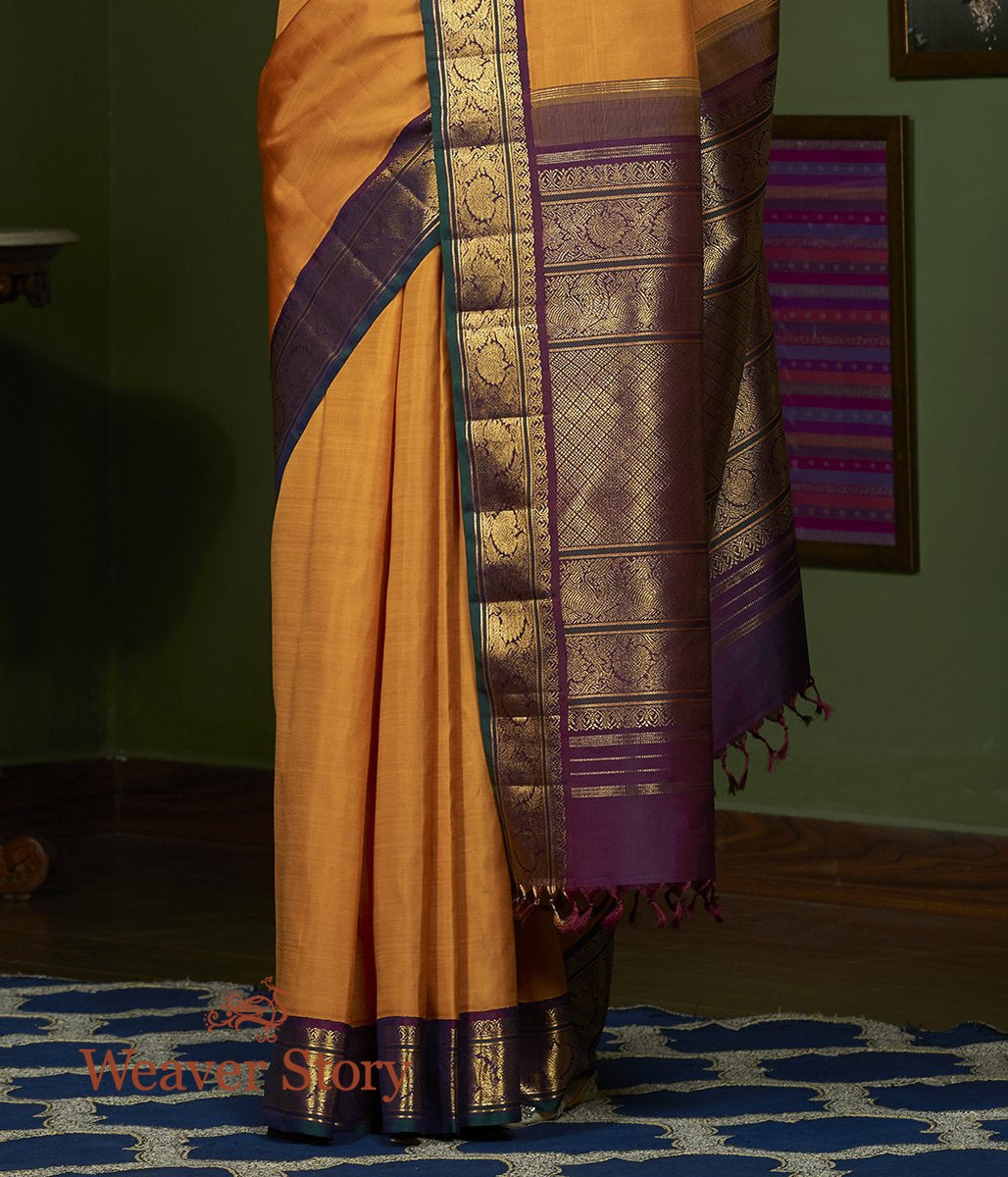 Handwoven_Mustard_Pure_Zari_Kanjivaram_Saree_with_Purple_Border_WeaverStory_04