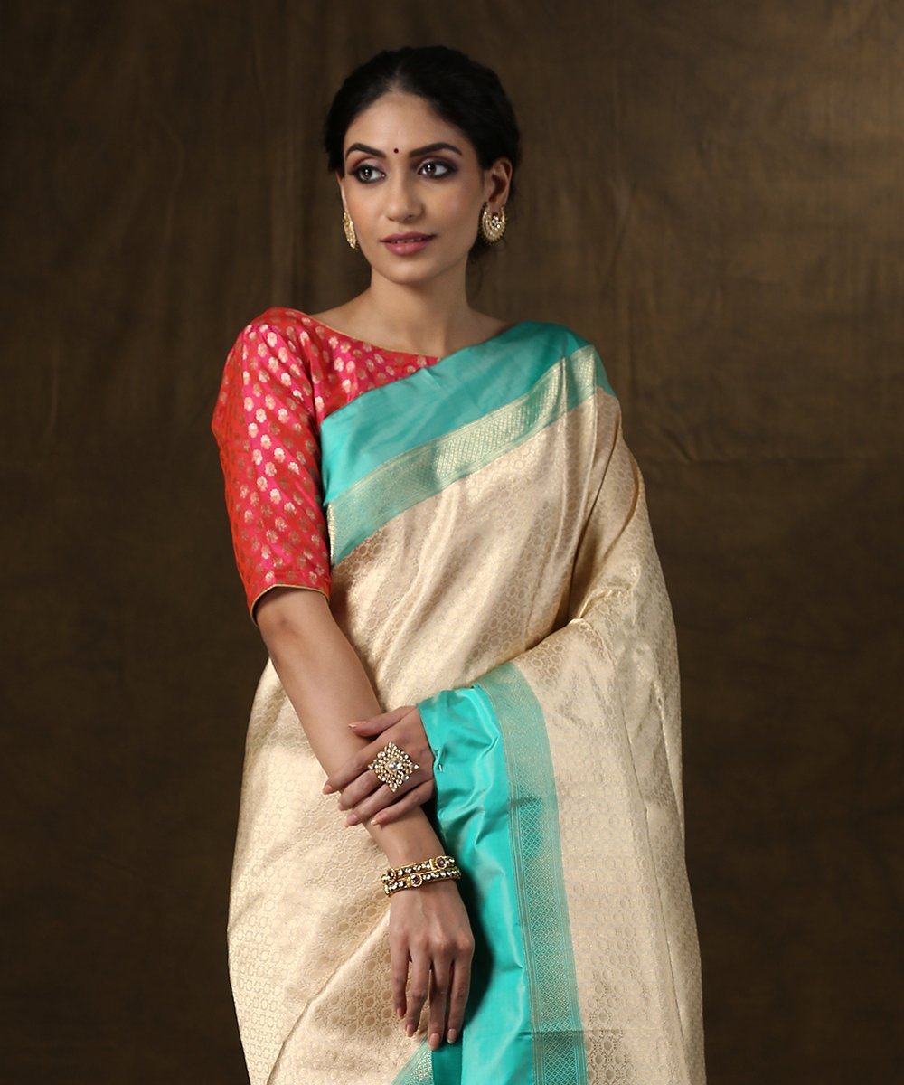 Handloom_Offwhite_and_Gold_Zari_Brocade_Banarasi_Saree_With_Aqua_Satin_Silk_Border_WeaverStory_01