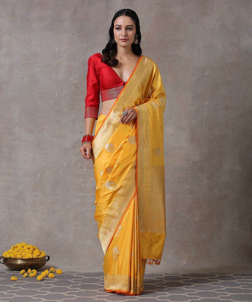 Handloom_Yellow_Ektara_Pure_Katan_Silk_Banarasi_Saree_With_Floral_Motif_And_Orange_Selvedge_WeaverStory_01