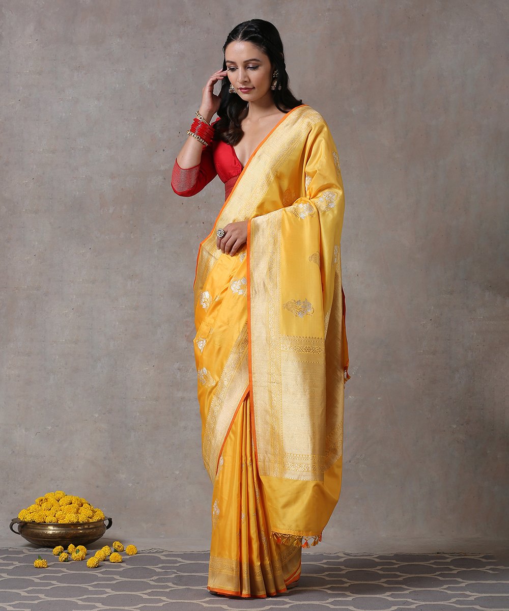 Handloom_Yellow_Ektara_Pure_Katan_Silk_Banarasi_Saree_With_Floral_Motif_And_Orange_Selvedge_WeaverStory_02