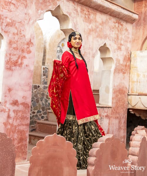 Green_Handloom_Velvet_Zardozi_Embroidery_Gararah_With_Red_Kurti_And_Red_Heavy_Embroidery_Chignon_Dupatta_WeaverStory_02