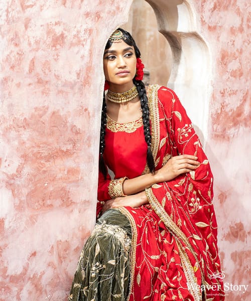 Green_Handloom_Velvet_Zardozi_Embroidery_Gararah_With_Red_Kurti_And_Red_Heavy_Embroidery_Chignon_Dupatta_WeaverStory_05