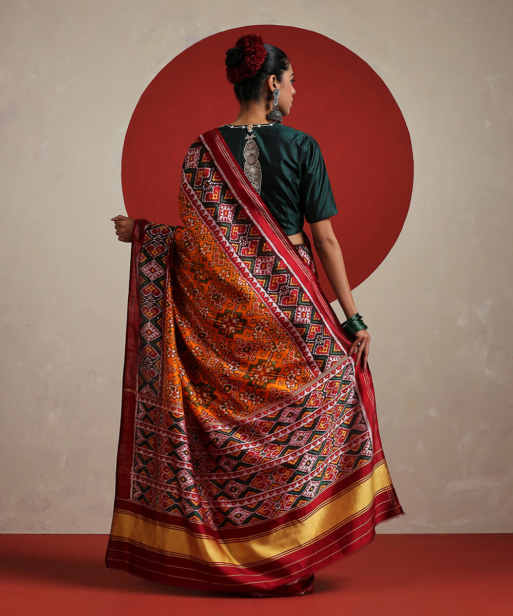 Handloom_Orange_Pure_Mulberry_Silk_Ikat_Patola_Saree_With_Twill_Weave_WeaverStory_03