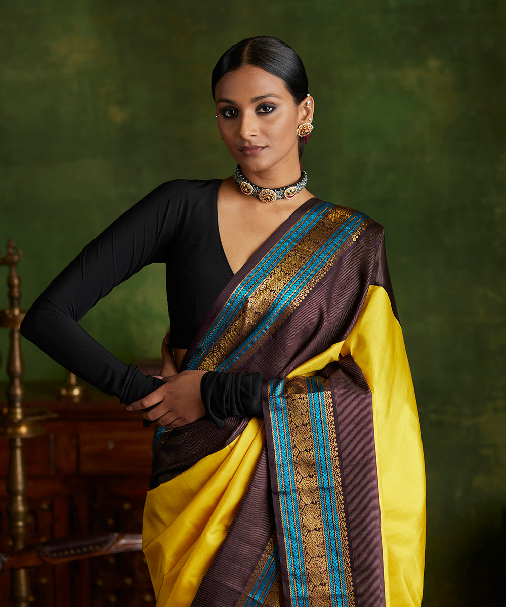 Handloom_Yellow_Pure_Silk_Kanjivaram_Saree_With_Korvai_Black_Border_WeaverStory_01