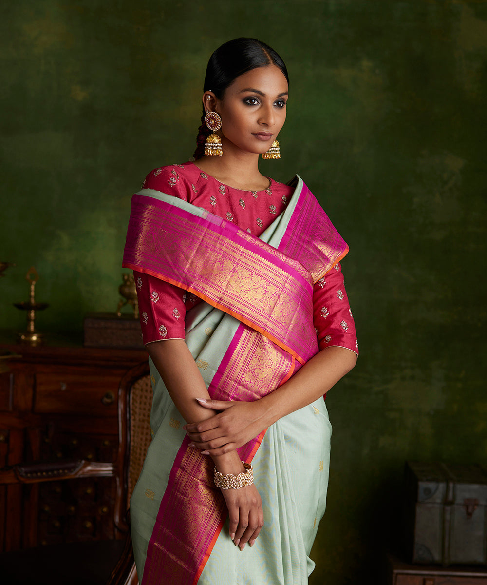 Handloom_Mint_Green_Pure_Silk_Kanjivaram_Saree_With_Korvai_Rani_Pink_Shikargah_Border_WeaverStory_01