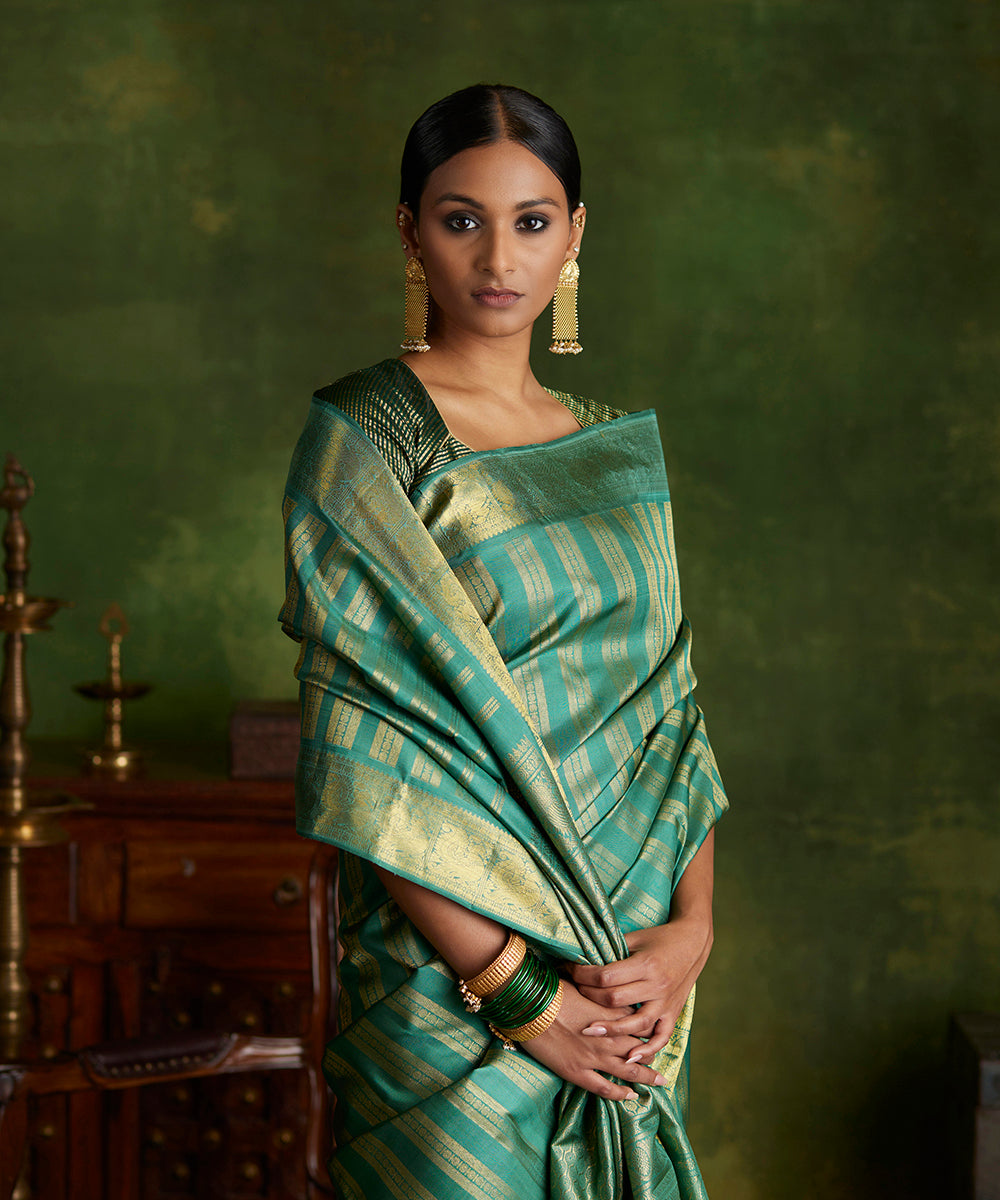 Sage_Green_Handloom_Pure_Zari_Kanjivaram_Saree_With_Vertical_Zari_Rudraksh_Stripes_WeaverStory_01