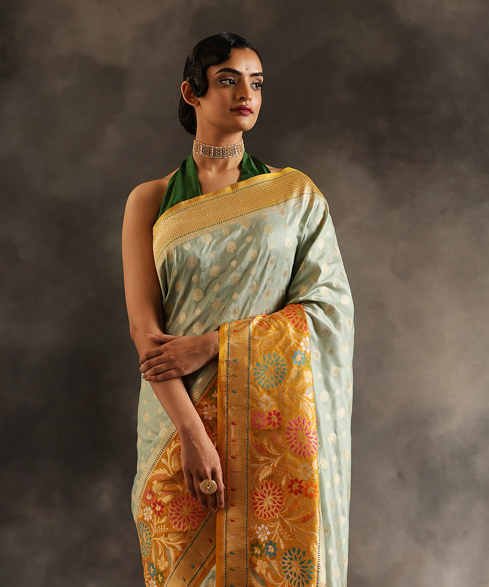 Handloom_Light_Blue_Pure_Katan_Silk_Banarasi_Saree_With_Zari_Booti_And_Yellow_Kadhiyal_Border_WeaverStory_01